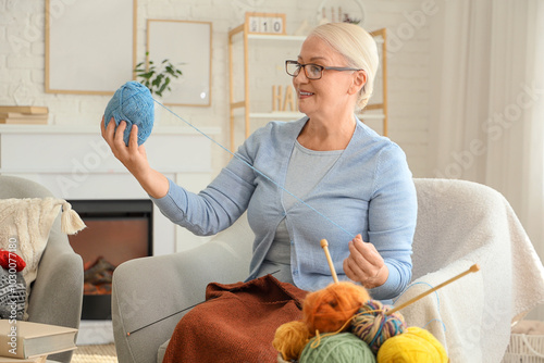 Mature woman with knitting ...