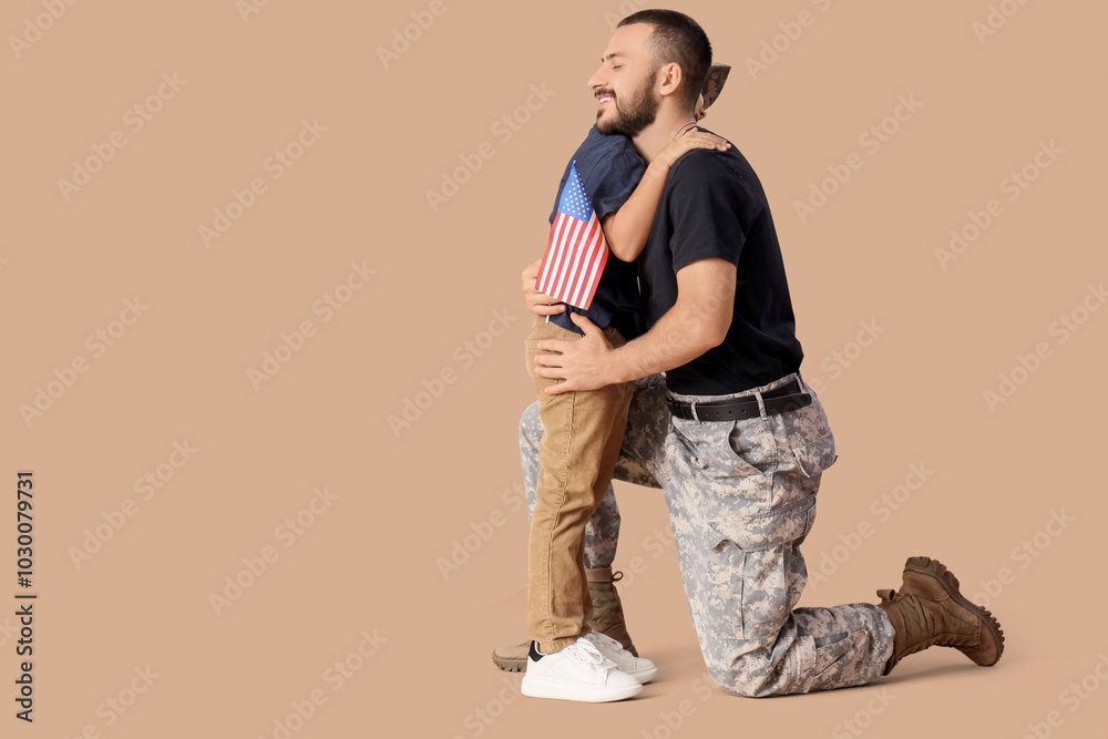 Fototapeta premium Little boy hugging his military father with USA flag on beige background. Veterans Day celebration