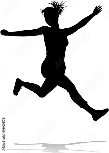 A happy woman jumping for joy in mid air silhouette person concept