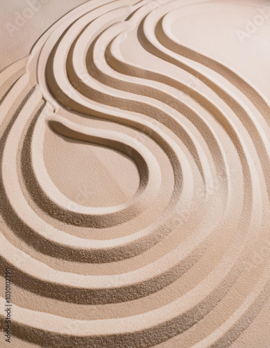 Pattern in Japanese Zen Garden with concentric circles on sand for meditation and tranquility. Aesthetic minimal sandy background. Top view.