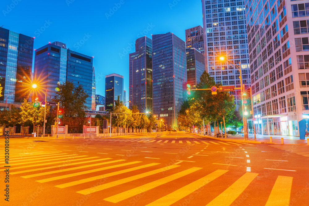 Obraz premium Modern architecture, asphalt roads, and urban night scenery in Beijing, the capital of China