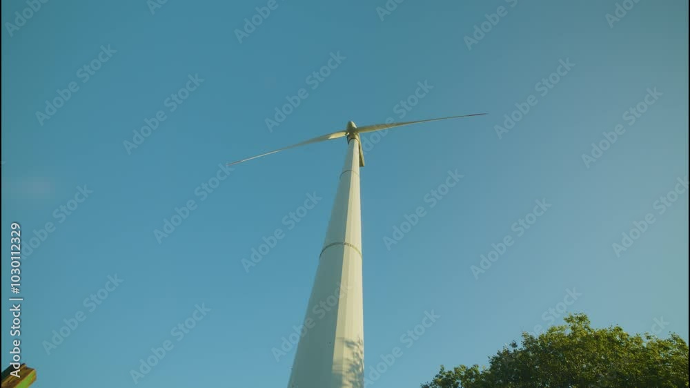 Wind farm turbines at sunrise with long lens Wind farm turbines at sunrise with long lens
