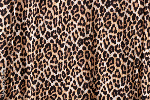 Abstract leopard texture background. Knitwear fabric with fashionable print.