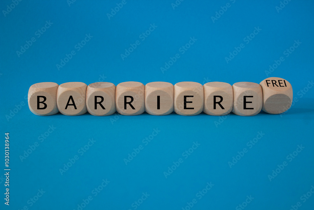 Turned a dice and changes the German word ‘Barriere’ (barrier) to ‘Barrierefrei’ (barrier free). Beautiful blue background. Business, psychological concept.