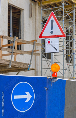 Exclamation Mark Warning Triangle Direction Arrow Traffic Signs Beacon Light at Construction Site photo