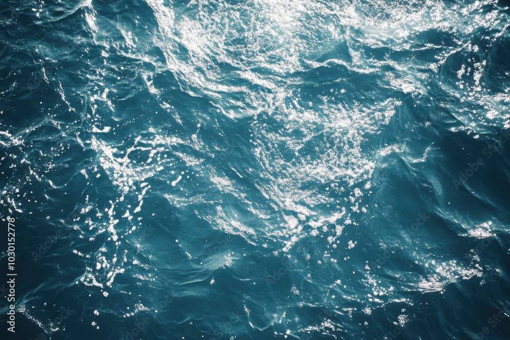 Overhead view of tranquil water texture with soft reflections in sunlight Overhead view of tranquil water texture with soft reflections in sunlight