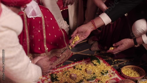 A Slow Motion Shot of an Indian Wedding where rituals are being performed in India
 photo