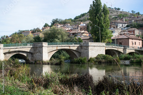 Vista del puente desde el parque junto al río de Pampliega, Burgos (España) photo