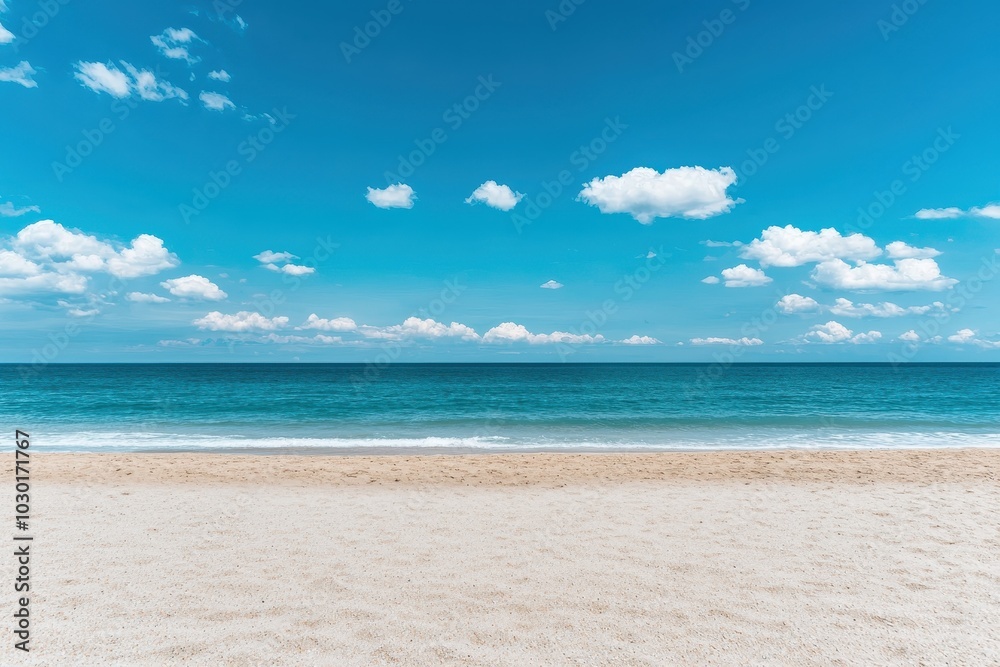 Pristine beach with soft sand and clear ocean under a bright blue sky with scattered clouds Pristine beach with soft sand and clear ocean under a bright blue sky with scattered clouds