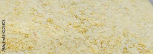 Flaked instant mashed potatoes at plastic fiber container