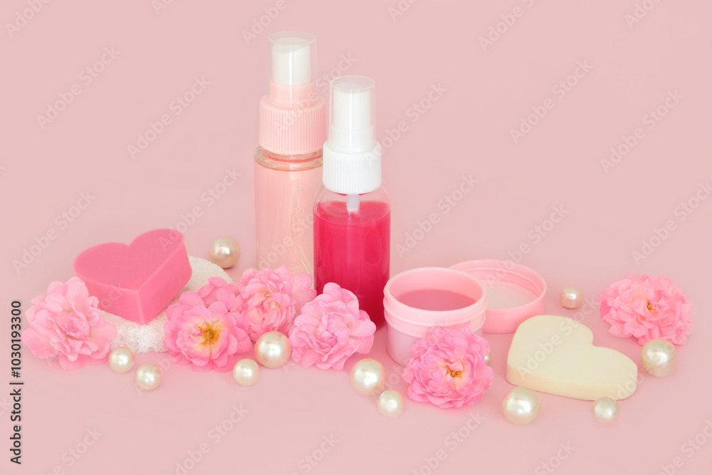 Rose flower spa feminine beauty treatment products for skincare healing on pink background with pearls. Treatments to soothe eczema, psoriasis, acne skin conditions. Rose flower spa feminine beauty treatment products for skincare healing on pink background with pearls. Treatments to soothe eczema, psoriasis, acne skin conditions.