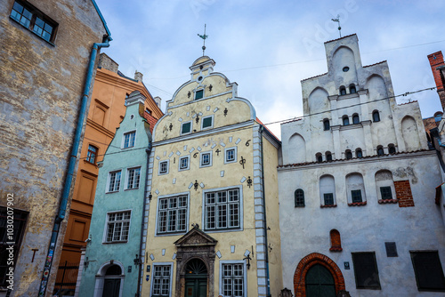 Historic architecture in Riga showcasing colorful facades and unique styles under a cloudy sky #1030207902