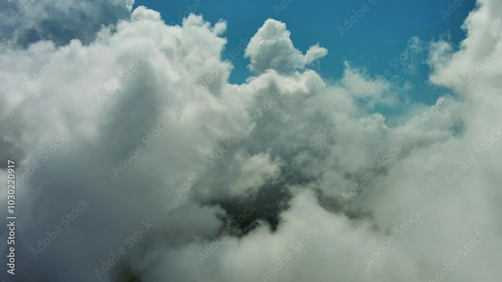 Flying through beautiful white fluffy clouds in blue sky. Airplane travel background, 4k Flying through beautiful white fluffy clouds in blue sky. Airplane travel background, 4k