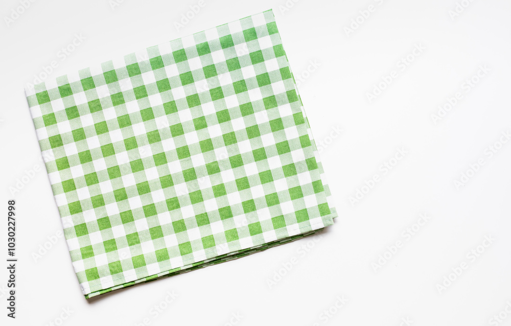 Placemat fabric cloth or arrangement of gingham-patterned fabrics in pastel green tones, isolate on a white background.food menu design textile Placemat fabric cloth or arrangement of gingham-patterned fabrics in pastel green tones, isolate on a white background.food menu design textile
