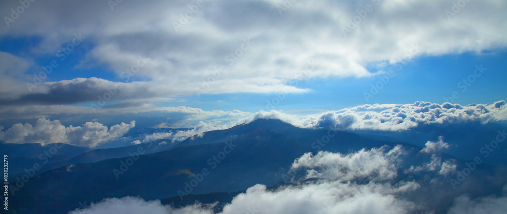 Between heaven and earth. Fog, clouds, nebula and clouds in the mountains. Beautiful landscape. Horizontal image. Between heaven and earth. Fog, clouds, nebula and clouds in the mountains. Beautiful landscape. Horizontal image.