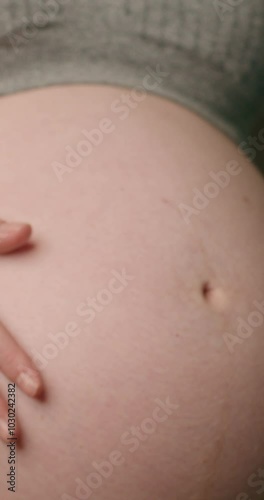 Wallpaper Mural Pregnant Woman Gently Caresses Her Belly, Embracing the Miracle of Life and Joy of Motherhood Torontodigital.ca