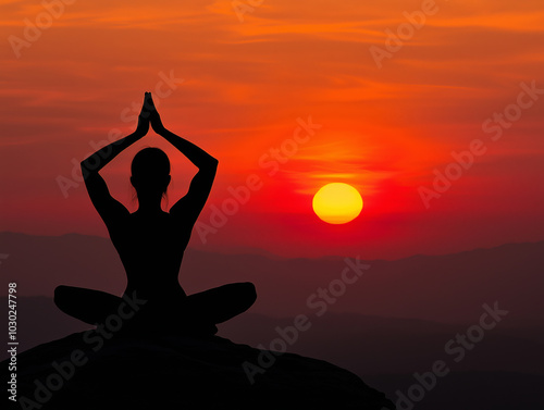 Silhouette of a person practicing yoga at sunset