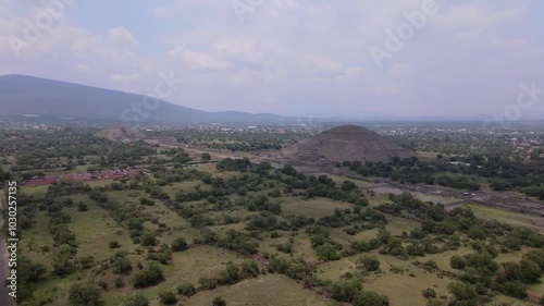 Wallpaper Mural Aerial drone footage of the Pyramid of the sun in Teotihuacan, Mexico on a cloudy day with mountains in the background Torontodigital.ca