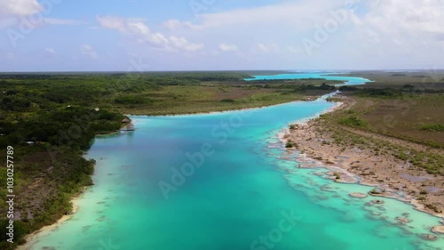 Wallpaper Mural Aerial drone footage over the turquoise waters of Laguna Bacalar on a sunny day, Quintana Roo, Mexico Torontodigital.ca