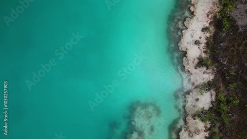 Wallpaper Mural Topdown aerial footage of two people kayaking on Laguna Bacalar, Quintana Roo, Mexico on a sunny day Torontodigital.ca