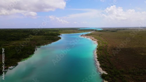 Wallpaper Mural Aerial drone footage over the turquoise waters of Laguna Bacalar on a sunny day, Quintana Roo, Mexico Torontodigital.ca