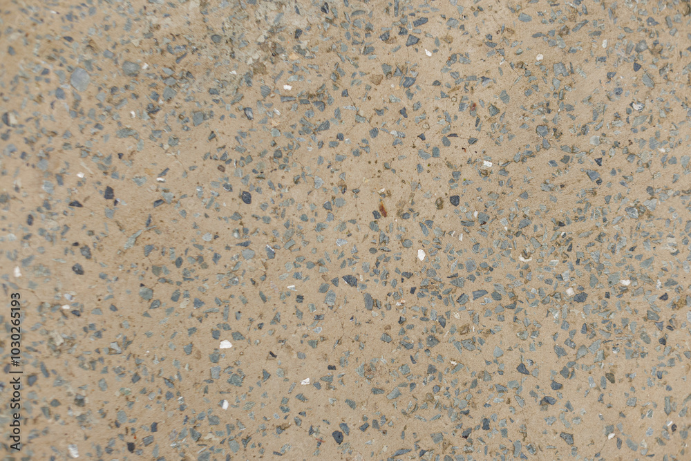 Close up view of a concrete sidewalk showing small stones embedded in the cement Karlin, Prague Close up view of a concrete sidewalk showing small stones embedded in the cement Karlin, Prague