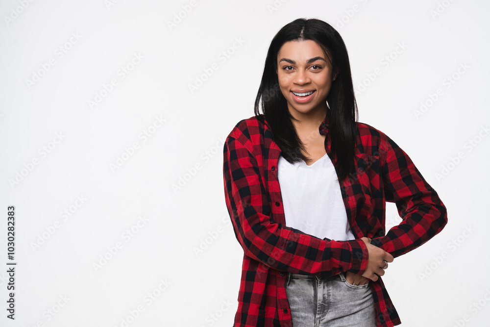 Portrait of young african american woman black girl female afro student in casual wear standing with hands on waist and looking at camera isolated over white background copy space. Portrait of young african american woman black girl female afro student in casual wear standing with hands on waist and looking at camera isolated over white background copy space.