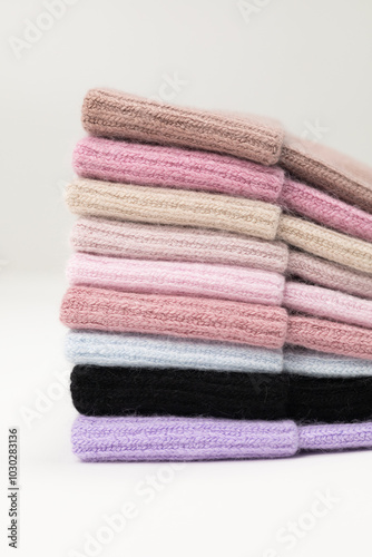 Collection of stylish knitted hats (pink, beige, black, white, gray, red) Composition of lined hats. A set of autumn - winter hat accessories
