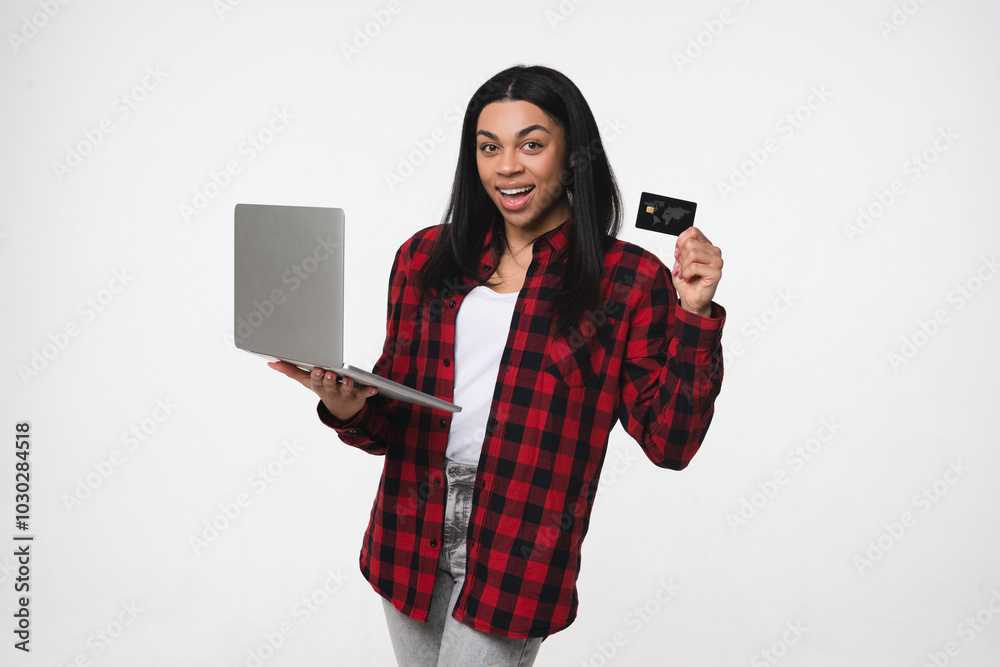 Naklejka premium Smiling young african american woman girl female student manager in casual holding laptop showing demonstrate plastic credit bank card using it for online shopping payment isolated on white background