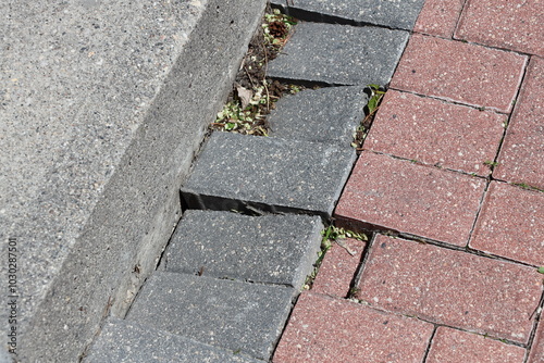 Billede på lærred sunken paving stones along an edge need repair