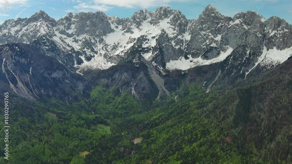 Aerial view on mountains in Triglav national park in Slovenia at spring, panorama 4k Aerial view on mountains in Triglav national park in Slovenia at spring, panorama 4k