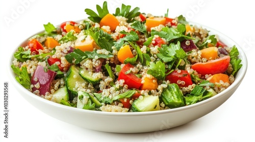 A healthy quinoa salad bowl loaded with colorful vegetables and herbs, presented on a white background, showcasing its nutritious appeal.