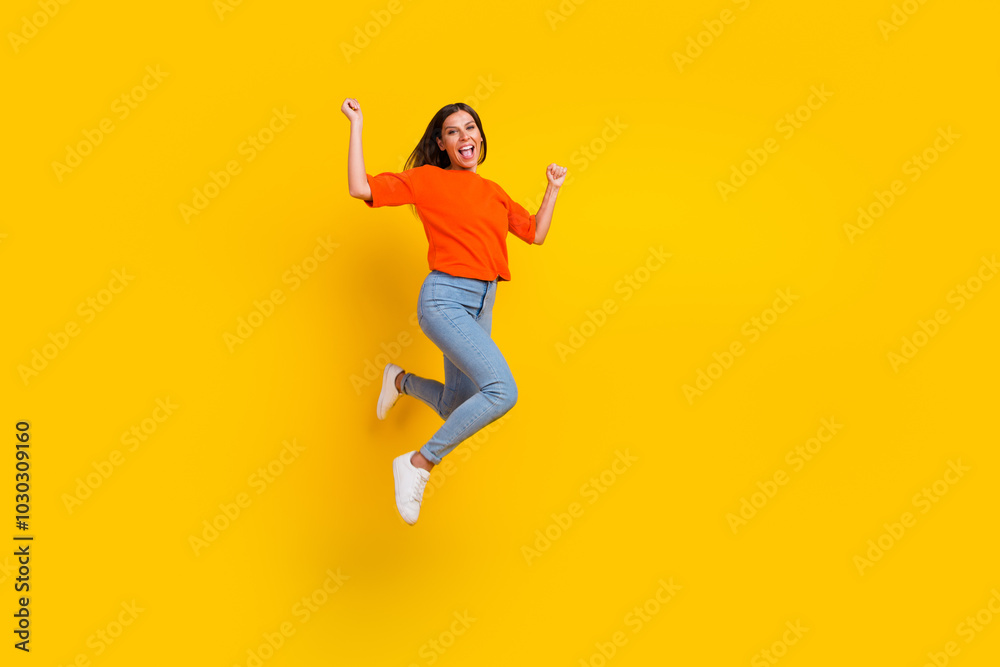 Full length body size view of nice attractive lovely glad cheerful wavy-haired girl jumping having fun rising hands up isolated on bright vivid shine vibrant color background Full length body size view of nice attractive lovely glad cheerful wavy-haired girl jumping having fun rising hands up isolated on bright vivid shine vibrant color background