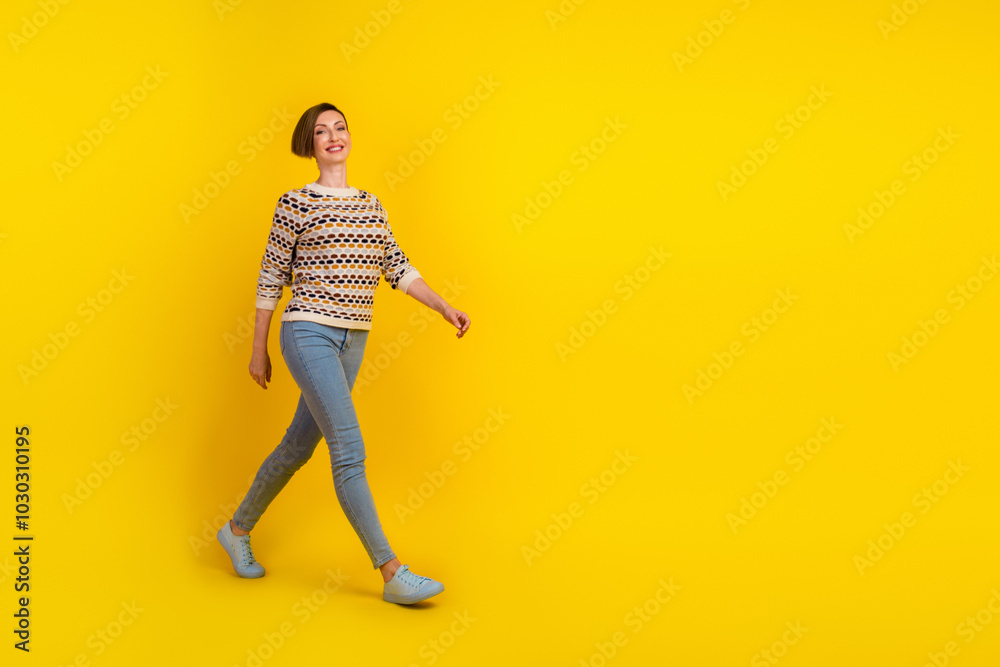 Full length portrait of beautiful woman go walk over yellow color bright copyspace background Full length portrait of beautiful woman go walk over yellow color bright copyspace background