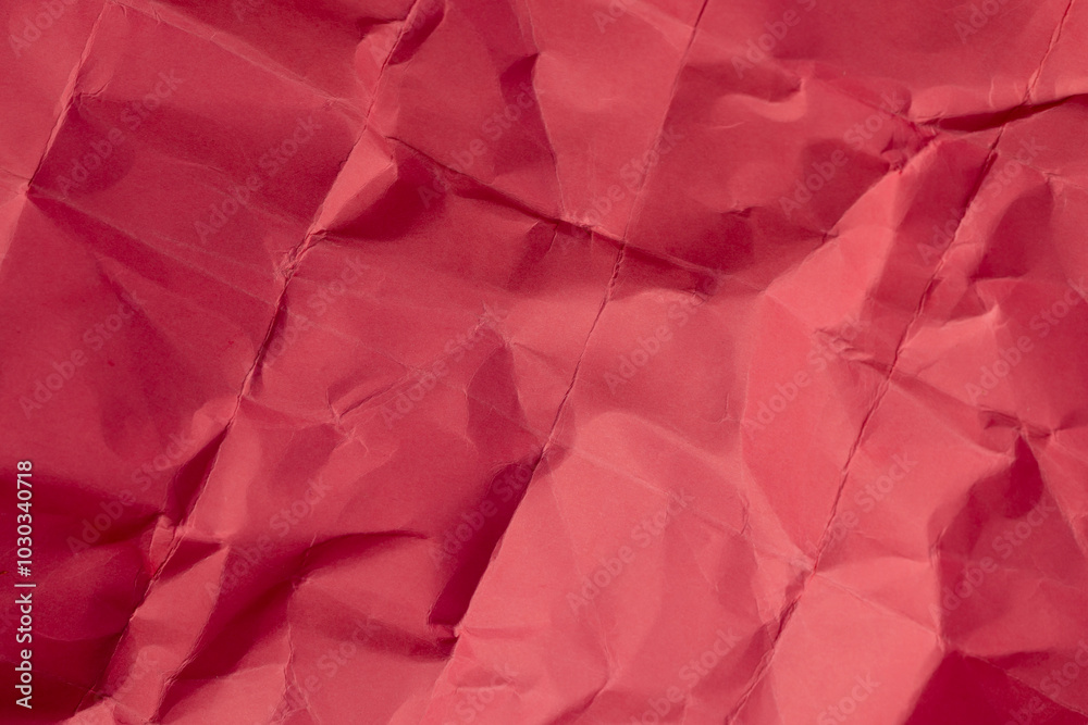 heavily crumpled red paper as background heavily crumpled red paper as background