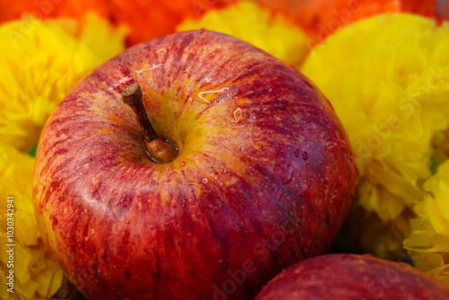 red apples and yellow flowers