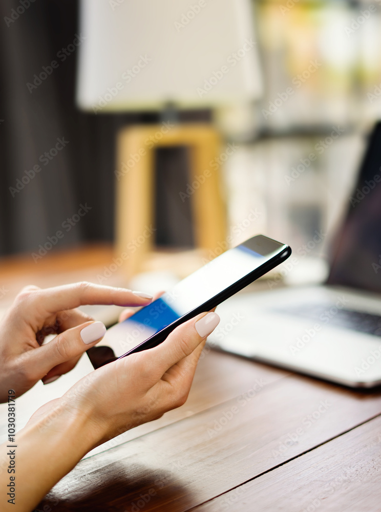 Fototapeta premium Woman pointing on smartphone screen, chatting in social networks, meeting website, searching internet, sending sms, using text messenger or online banking