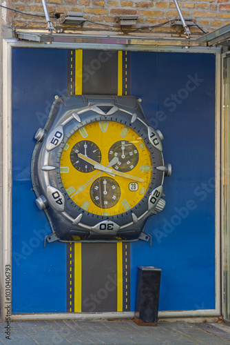 Big Yellow Modern Sport Chronograph Stop Watch at Wall photo