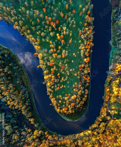 Obraz na płótnie Colorful sunrise over the Gauja National park valley. Sigulda city panorama from drone with forest in autumn colors. w salonie