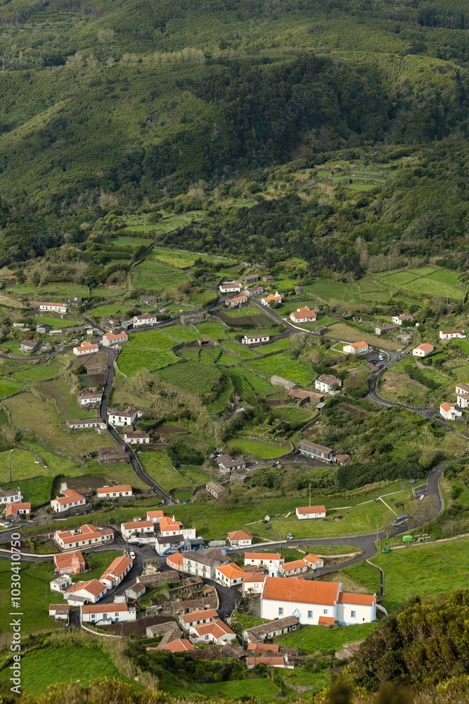 Breathtaking view of the houses on the cliff at Atlantic ocean coast in Azores islands Portugal
