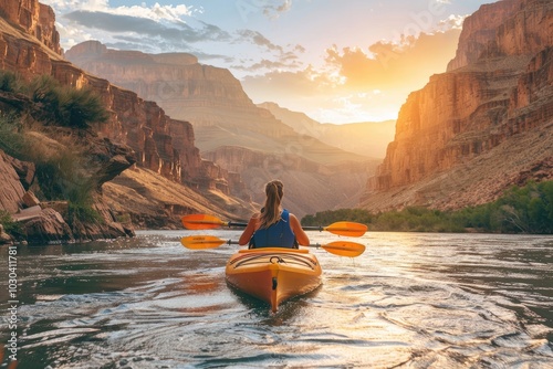 Woman kayaking in Grand Canyon at sunset, Utah, USA. beautiful landscape with mountains and river photo