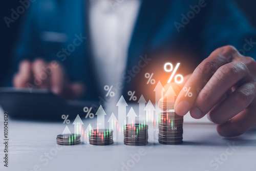 Obraz na płótnie Dividend and interest rates with symbols and arrows up on stacks of coins, representing returns on stocks and mutual funds. Long-term investment income, showing the growth potential of stock market. w salonie