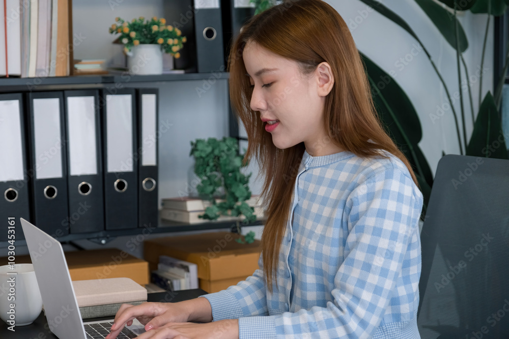 Young woman working on laptop and paperworks. Young woman working on laptop and paperworks.