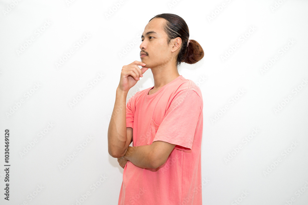 An Indonesian, Asian man wearing a pink tshirt formal style involving his partner with standing confidence like a mature person and a young businessman. isolated in white background An Indonesian, Asian man wearing a pink tshirt formal style involving his partner with standing confidence like a mature person and a young businessman. isolated in white background
