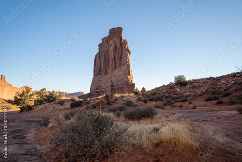 A low-angle view of the Courthouse Towers red rocks in Arches National Park. photo