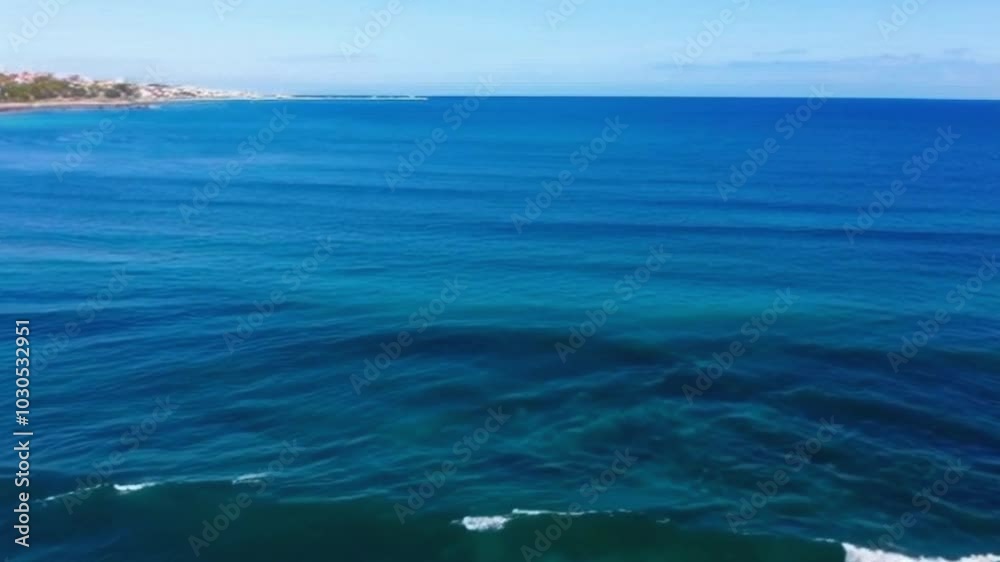Serene Wide-Angle Ocean View Calm Waves and Clear Sky Seascape Shot for Peaceful, Natural Scene - Ideal Stock Footage Serene Wide-Angle Ocean View Calm Waves and Clear Sky Seascape Shot for Peaceful, Natural Scene - Ideal Stock Footage