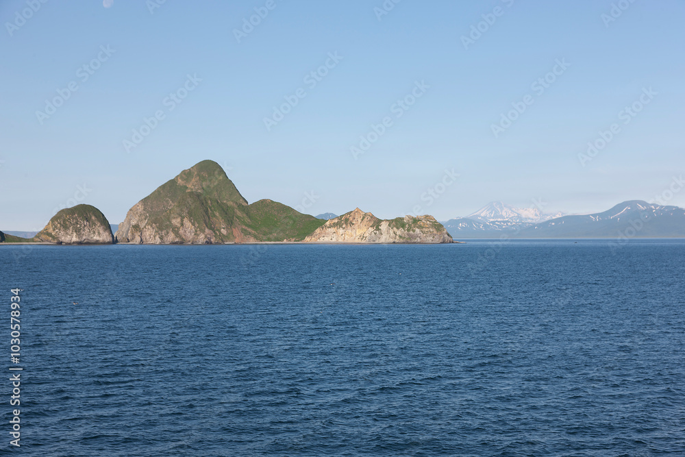 Russia Kuril Islands view from the sea on a sunny summer day Russia Kuril Islands view from the sea on a sunny summer day