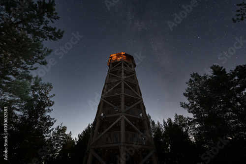 Pikanomme is a high wooden observation deck in the forest at night under the starry sky. photo