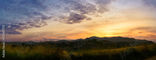 Morning time of panorama mountain under dramatic twilight sky and cloud. Nightfall Silhouette mountain on sunset.