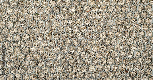 Cells with pebbles. Background texture pattern. Texture of floor view from above, Pavement made of cells with pebbles, texture. Concrete paving slabs, Above view concrete walkway or footpath
